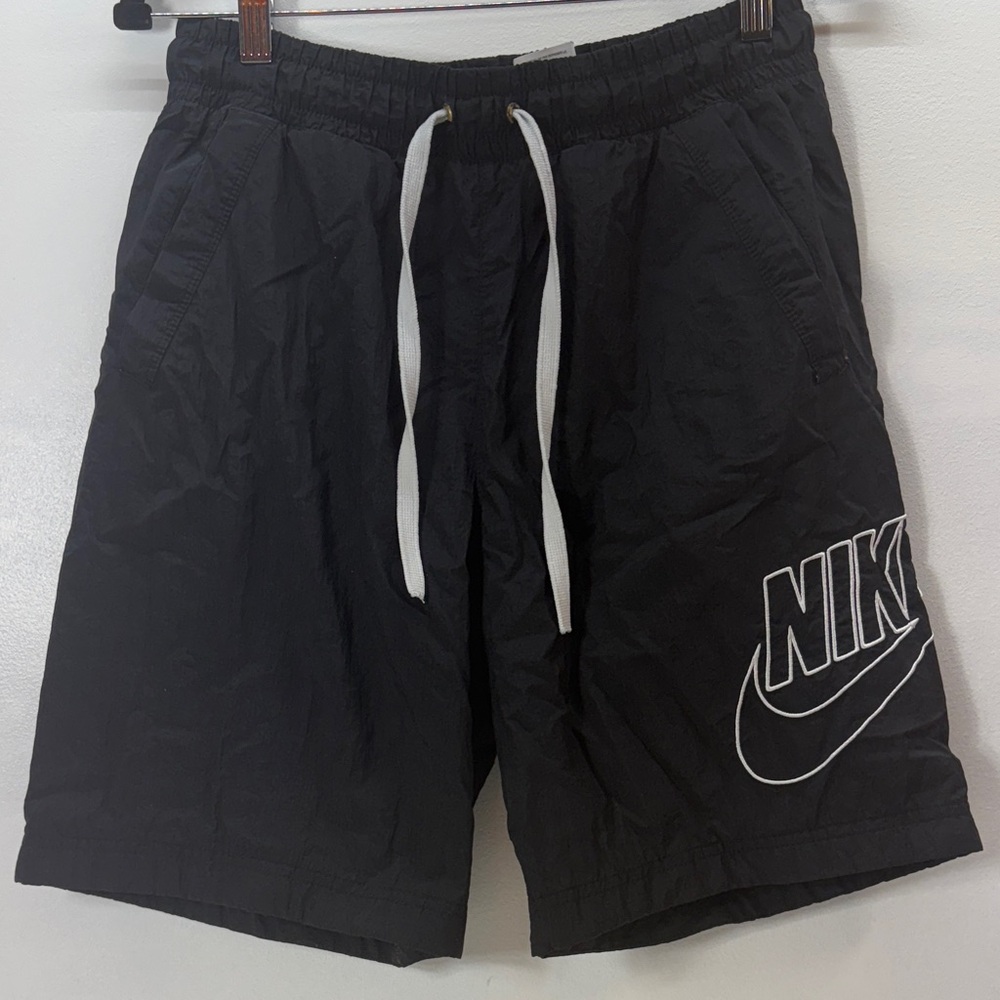 Nike Black Shorts with White Accents & Side Pockets